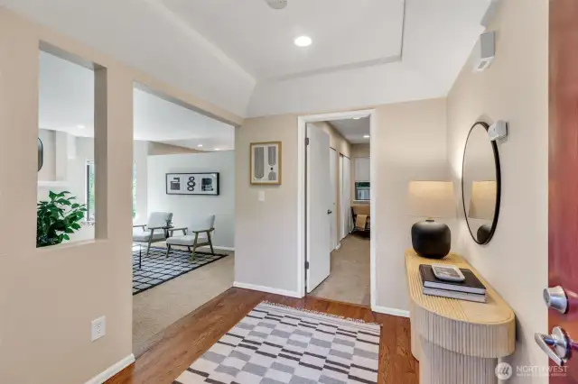 Spacious entry with hardwood floors.
