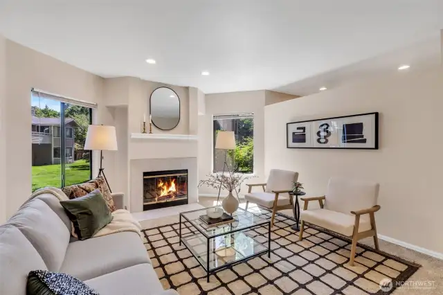 Stunning living room featuring a timeless wood-burning fireplace.