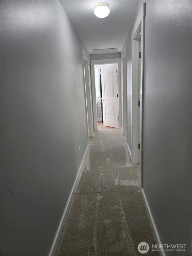 Upstairs hallway leading to bedrooms and shared bathroom