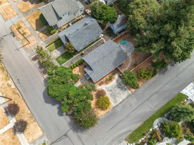 The bird's-eye view showcases the easy-to-maintain landscaping, extensive flagstone pathways and large backyard patio. Even the off-street parking has had a classy refresh!