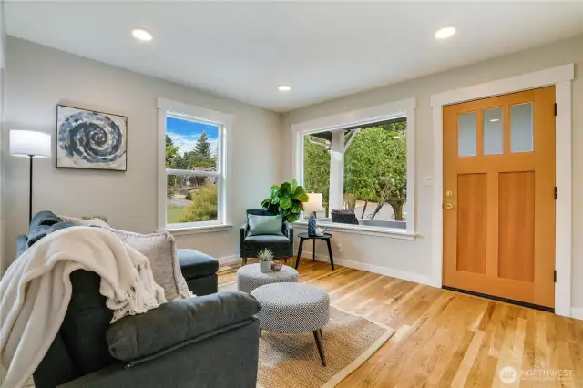 Curl up with a novel and soak in the street’s quiet buzz—this spot was made for slow mornings and sunny afternoons. Note the brand-new trim along the baseboards, windows and new front door!