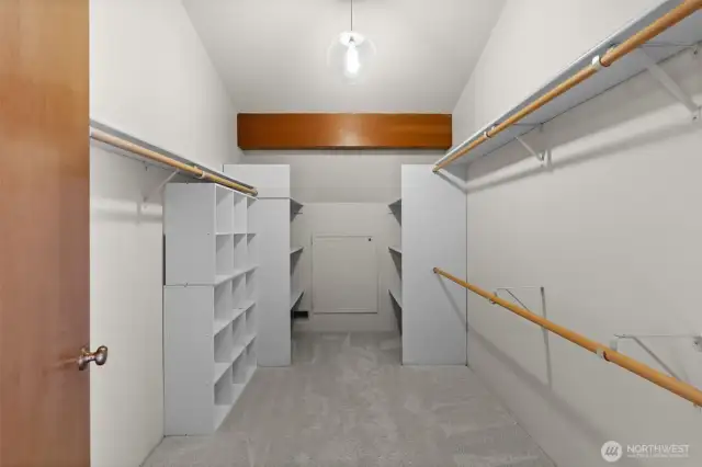 A spacious primary closet with plenty of room for all your wardrobe needs.