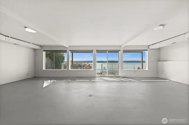 The largest waterside flex room in the partially finished basement —ideal as a home gym, theater, or bonus space—featuring fresh paint, large windows, and endless possibilities.
