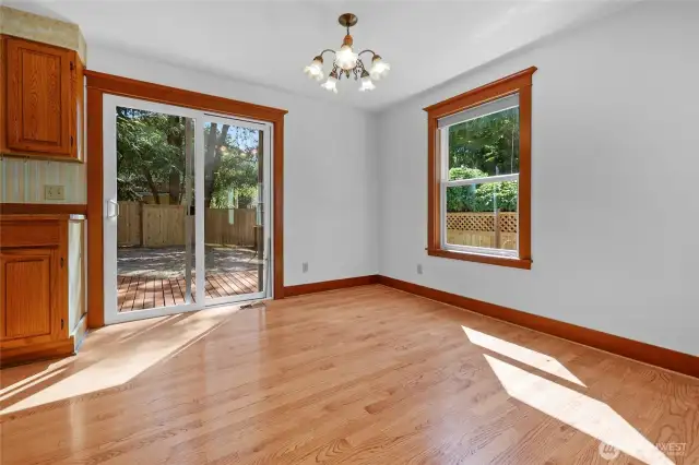 Dining area opens to kitchen and backyard.