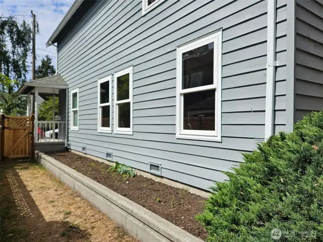 Raised bed south facing garden, full length of house.