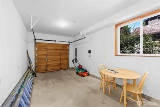 Single car garage with sliding window.