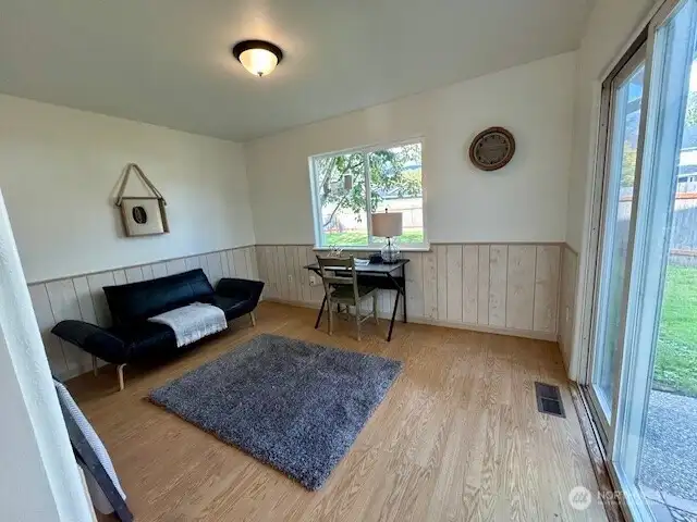 Extra finished room on back side of kitchen could make for great home office, playroom or formal dining area.