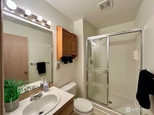 Full bath upstairs with spacious shower.