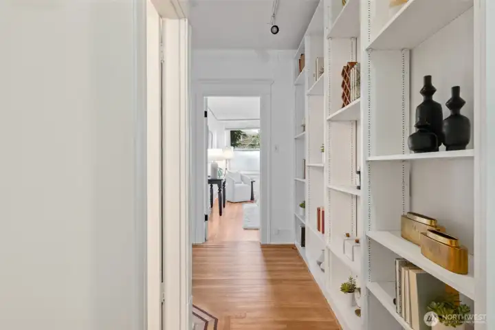 From front door, looking down hall towards bedroom- door on the left is the full bathroom