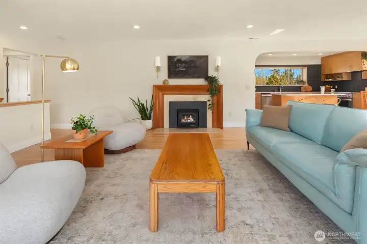 Living space with fire place. Fire added for visual, buyer to verify functionality.