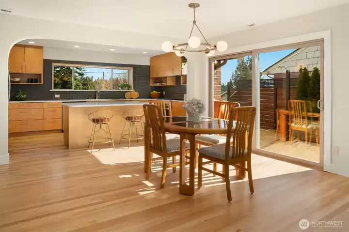 Dining area flowing seamlessly into designer kitchen.
