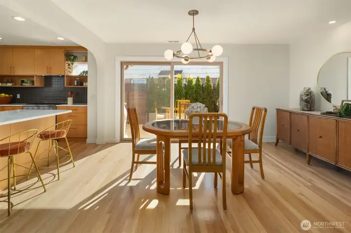 Dining area with new sliding glass doors leading to outdoor patio.