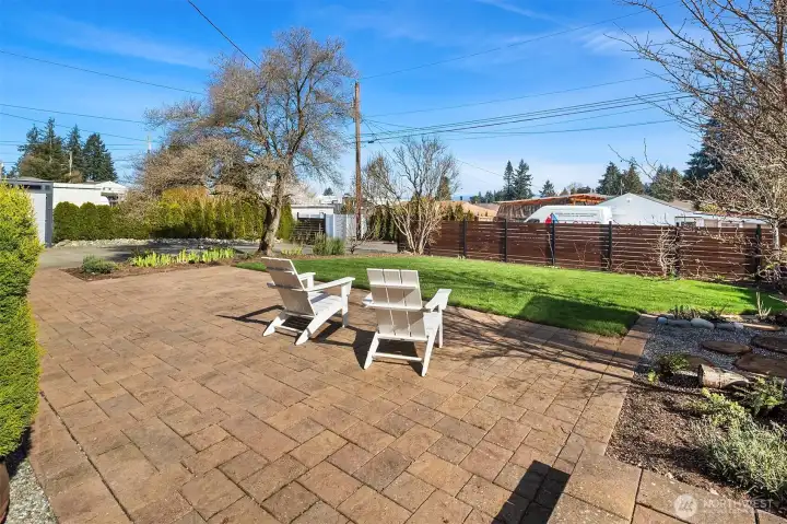 Back patio showing additional alley access to home.