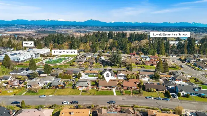 Aerial view facing East showing close proximity to YMCA, parks, and schools.