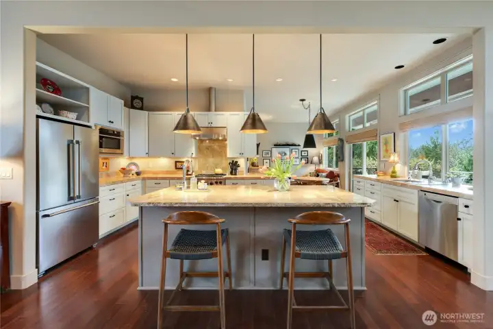 his large Luxe island has slab granite and a second sink.