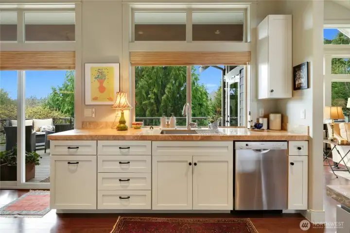 The well planned out design of this kitchen has a seperate area for the main sink and dishwasher.
