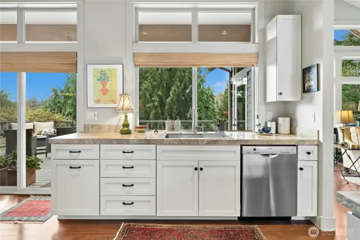 The well planned out design of this kitchen has a seperate area for the main sink and dishwasher.