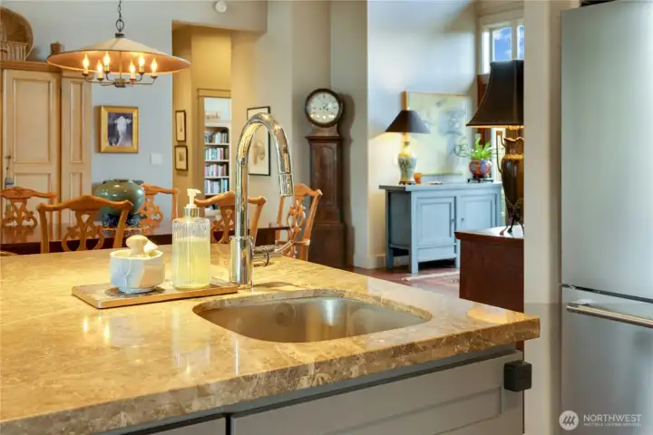 The well planned out design of this kitchen has a seperate area for the main sink and dishwasher.