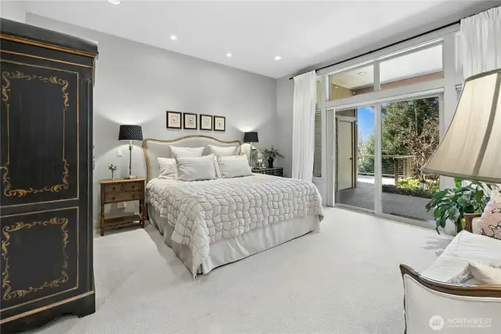 A very spacious Primary Bedroom has doors to a private patio and a beautiful ensuite bathroom and large walk in closet.