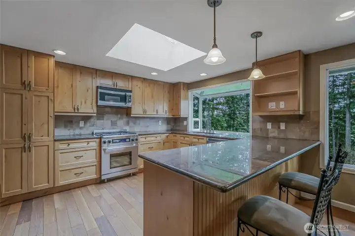 A spacious kitchen offers the perfect space for cooking, gathering, and entertaining.
