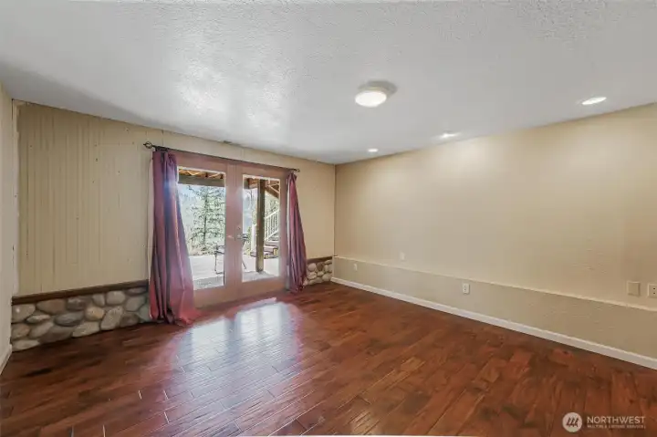 Lower level bedroom with access to the backyard offers flexibility for guests, multigenerational living.