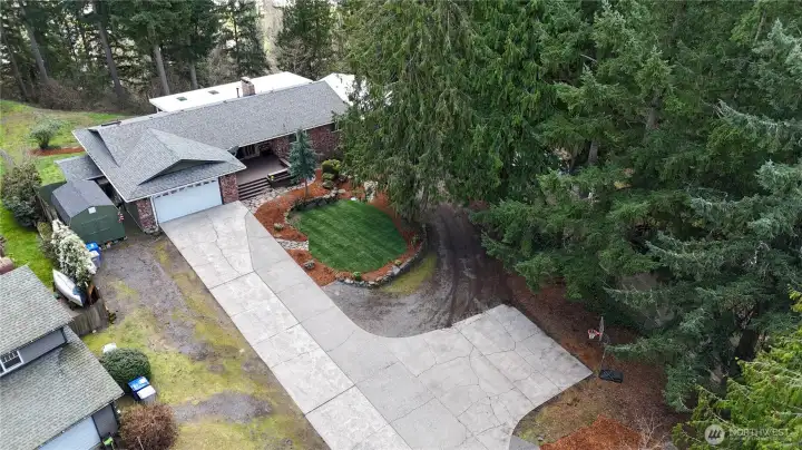 Spacious driveway and garage offering plenty of parking and storage.