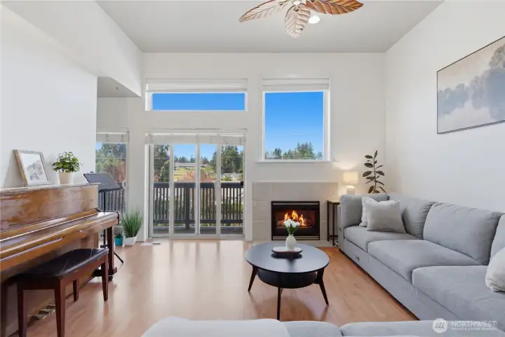 The main floor is light, bright, and airy with high ceilings, a fresh coat of interior paint, and beautiful wood floors!