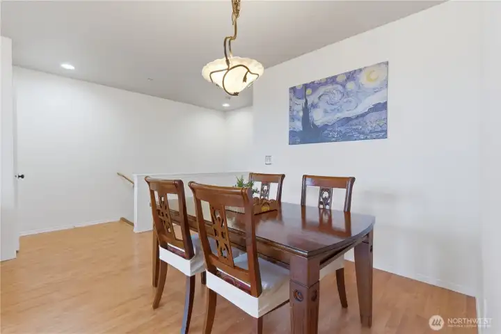 Another view from the dining room with staircase to the lower level seen in the background