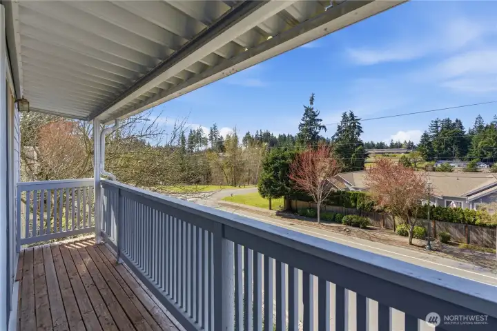 The back balcony extends nearly the full length of the townhome with plenty of space for potted plants and a couple of chairs to enjoy the evening sunset