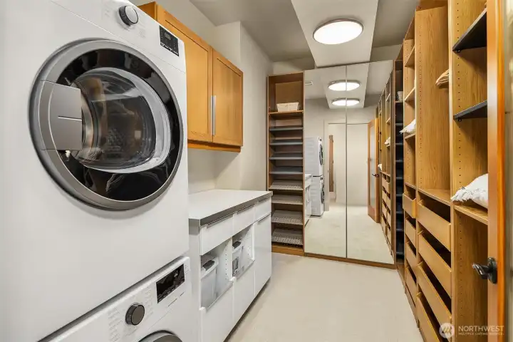 Primary walk in closet with laundry
