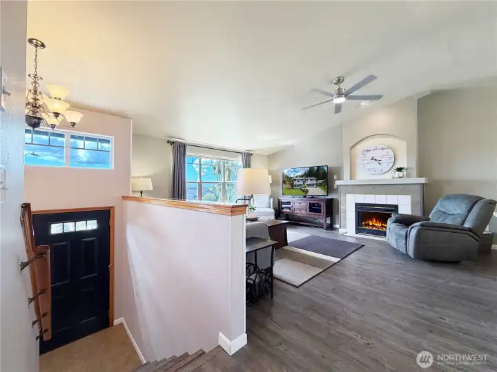 Large living area with cozy gas fireplace