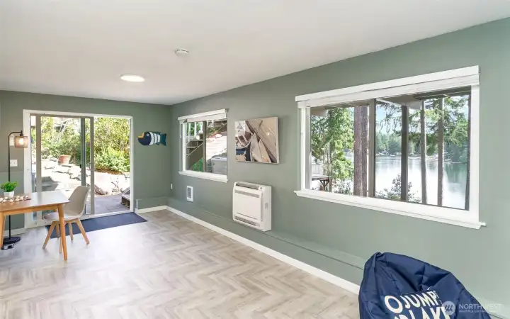 Downstairs bonus room with slider to the hot tub and lake