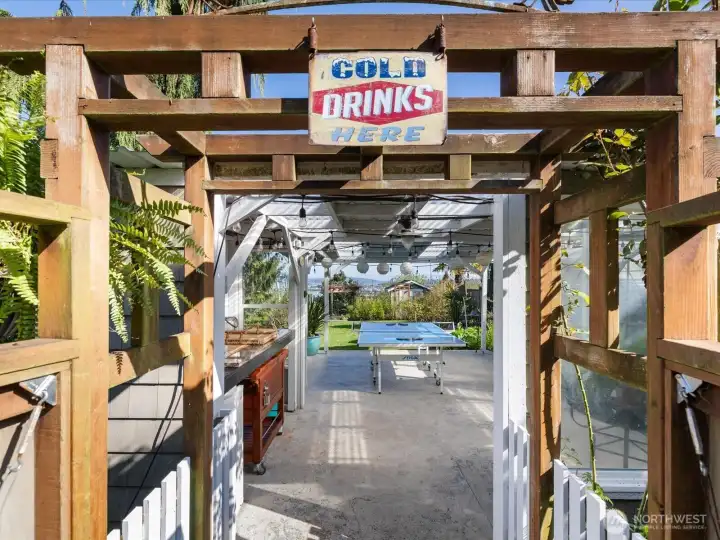 Backyard entertainment space + greenhouse