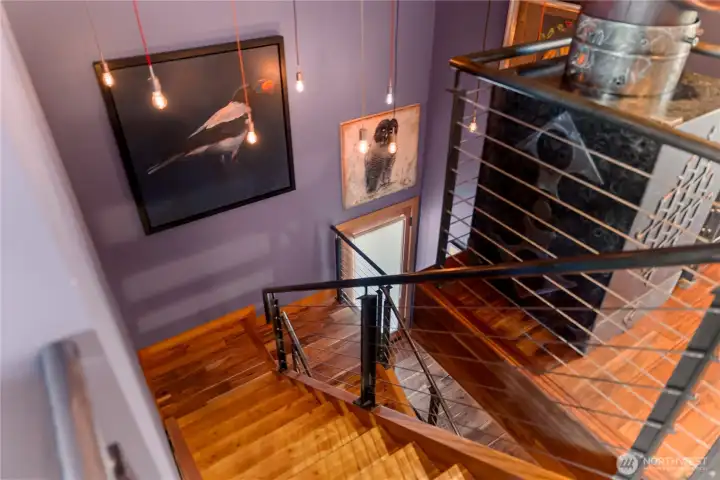 The beautifully designed stairwell does double duty as an art gallery.