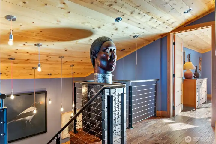 The stairs lead to the upper story kitchen, living and bedroom spaces.