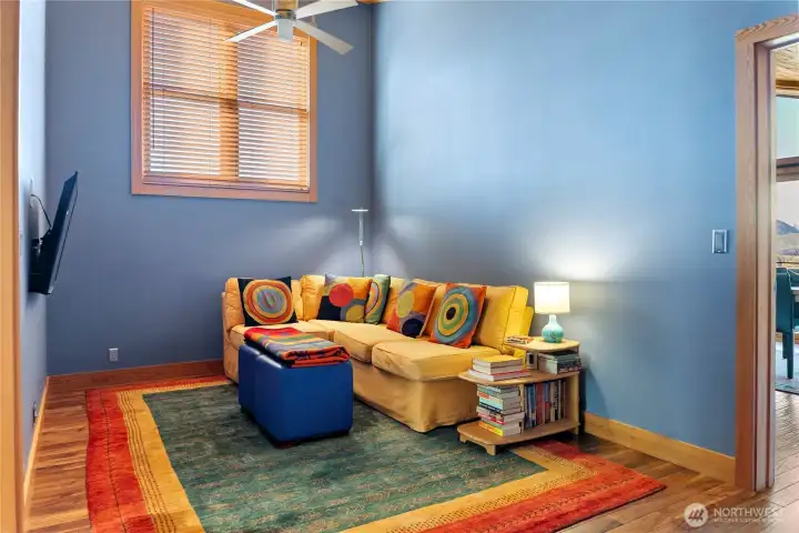 The living room makes for cozy reading or film screenings.