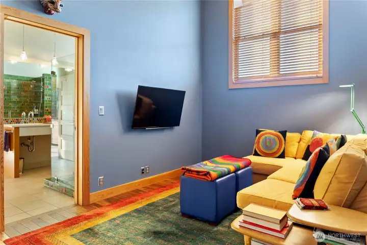 A doorway leads to the incredible bathroom and bedroom beyond.