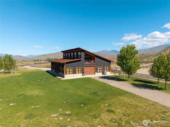 The stunning building is well positioned for a future garden with fencing, water rights, installed irrigation and more.