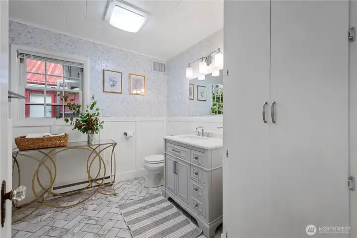 Fully updated and renovated main-level bathroom boasting large, modern fixtures and layouts