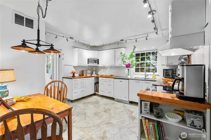 New updated kitchen with tiled floors and eating area