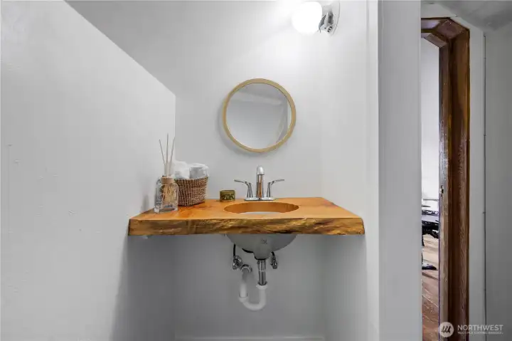 upstairs sink and toilet room.Marble tiled mosaic floor