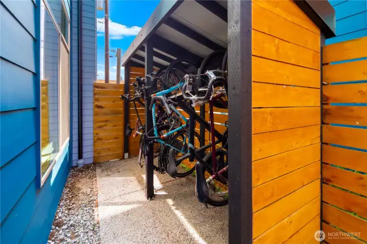Covered bike storage along the south side of your home.