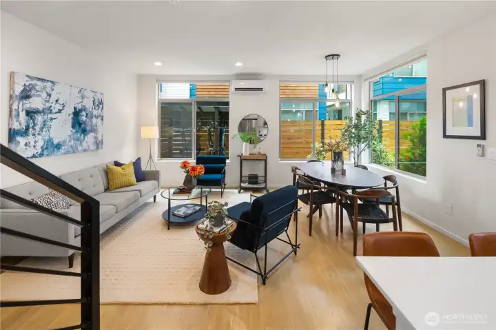 Nice shot from the kitchen of the living and dining spaces. High ceilings with an abundance of natural light.