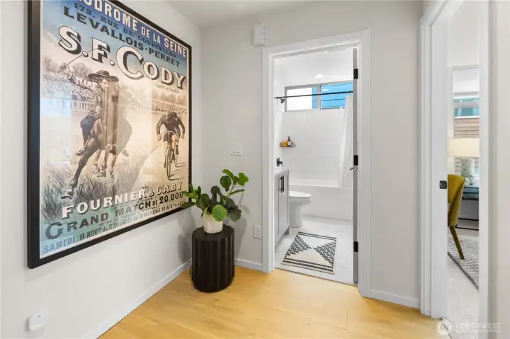 Before we take a look at the second bedroom, let's pop our head into the full-size bath right in front of us.