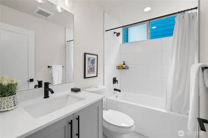Good sized full bathroom with modern touches.
