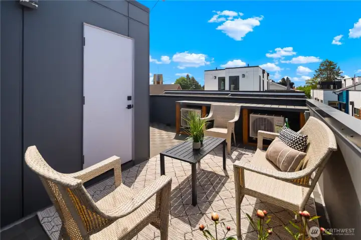 Cool outdoor deck with lots of room to entertain, barbecue, hang out and have your morning coffee, or you can even have a garden box or two to satisfy your green thumb. Through the closet door on the left is your tankless water heater, a garden hose hook up, and built-in shelving as well. A nice convenient space for outdoor storage.