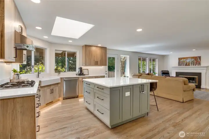 The remodeled kitchen opens naturally to the dining and family rooms, helping keep daily life connected. Ample cabinetry, a pantry, pull-out storage, and hardwood floors enhance both function and style. The remodeled kitchen opens naturally to the dining and family rooms, helping keep daily life connected. Ample cabinetry, a pantry, pull-out storage, and hardwood floors enhance both function and style.