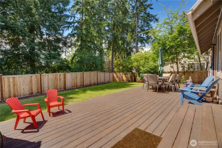 The back deck extends along the length of the home, overlooking a private fenced yard framed by mature trees—perfect for cool summer evenings. There’s plenty of room here to play, relax, and roam. The back deck extends along the length of the home, overlooking a private fenced yard framed by mature trees—perfect for cool summer evenings. There’s plenty of room here to play, relax, and roam.