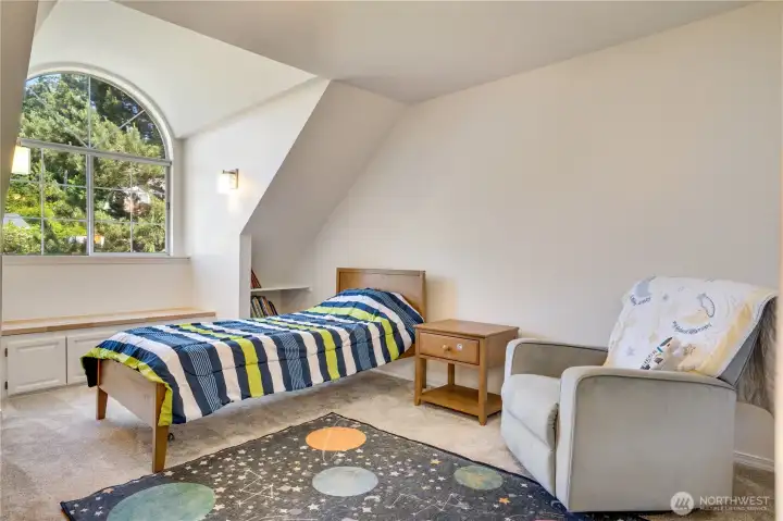 32. A bright upstairs bedroom complete with built-in storage and a newly refinished window seat—ideal for reading, relaxing, or extra seating. 32. A bright upstairs bedroom complete with built-in storage and a newly refinished window seat—ideal for reading, relaxing, or extra seating.