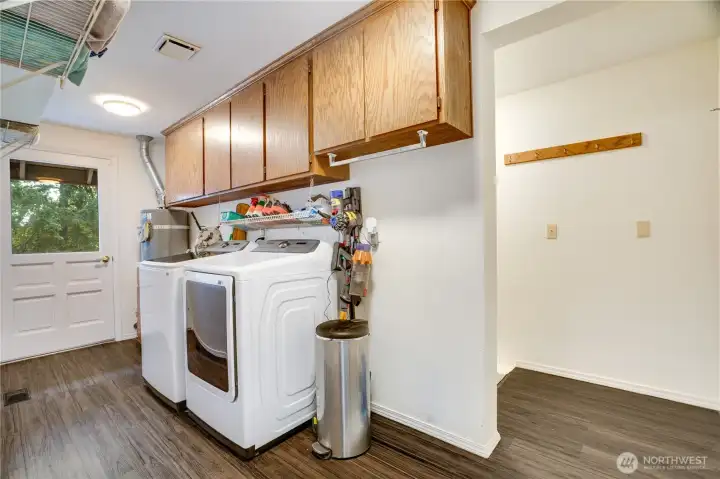 The laundry/mudroom sits right off the downstairs family room and offers abundant storage, a convenient door to the oversized two-plus-car garage, direct access to the backyard, and a connection to the semi-finished basement. The laundry/mudroom sits right off the downstairs family room and offers abundant storage, a convenient door to the oversized two-plus-car garage, direct access to the backyard, and a connection to the semi-finished basement.